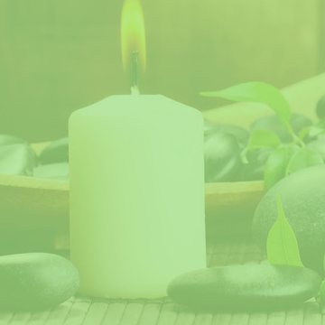 Candles and smooth stones in a calm wellness room